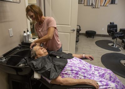 Seniors In Salon, Receiving Care.