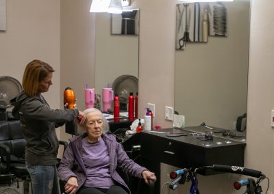Woman Receiving Hair Treatment At Salon